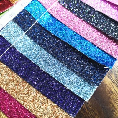 Großhandel PU Glitzerpulver Korn Kunstleder Geldbörsenetui Schuhe Notizbuch Leder Stoff