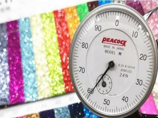 Großhandel PU Glitzerpulver Korn Kunstleder Geldbörsenetui Schuhe Notizbuch Leder Stoff