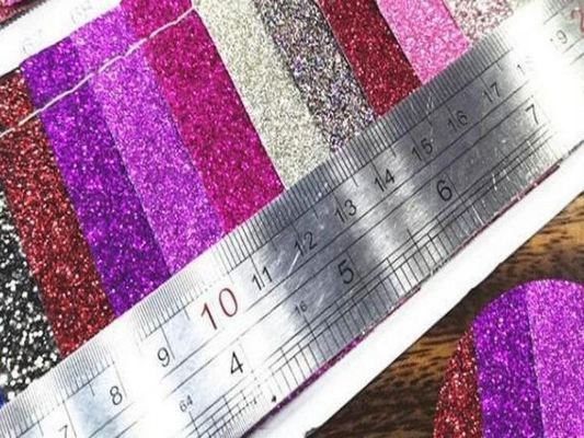 Großhandel PU Glitzerpulver Korn Kunstleder Geldbörsenetui Schuhe Notizbuch Leder Stoff