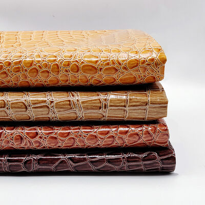 Warmverkauf PVC glänzendes, hochglänzendes, synthetisches Leder, geprägtes Steinmuster für Schuhe, Taschen, Notizbücher, Möbel